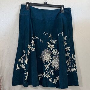This is a Talbots teal corduroy A-line floral beaded midi skirt